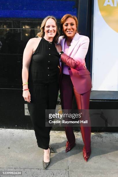 Amber Laign and Robin Roberts celebrate Robin Roberts' 20th "GMA" anniversary outside "Good Morning America" on April 14, 2022 in New York City.