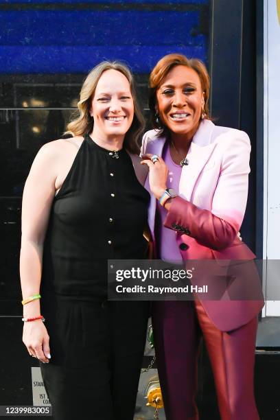 Amber Laign and Robin Roberts celebrate Robin Roberts' 20th "GMA" anniversary outside "Good Morning America" on April 14, 2022 in New York City.