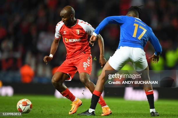 Sporting Braga's Libyan midfielder Ali Musrati vies with Rangers' Nigerian midfielder Joseph Ayodele-Aribo during the UEFA Europa League...