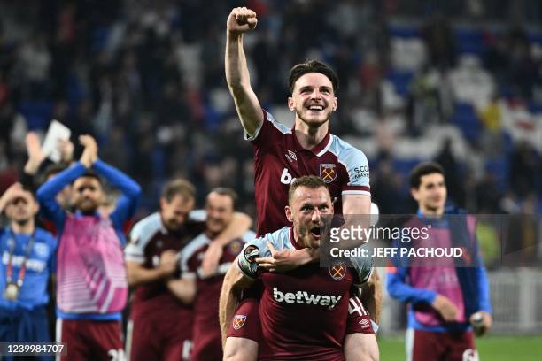 West Ham United's English midfielder Declan Rice and West Ham United's Czech defender Vladimir Coufal celebrate after winning the UEFA Europa League...