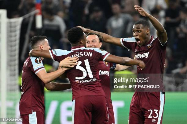 West Ham United's French defender Issa Diop celebrates victory with teammates after the UEFA Europa League quarter-final second-leg football match...