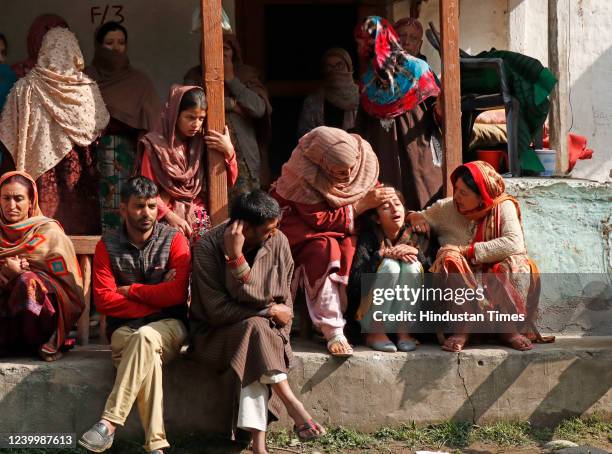 Daughter of Satish Kumar Singh mourns during his funeral procession, at Kakran village on April 14, 2022 in Kulgam, India. Singh, a driver who was...