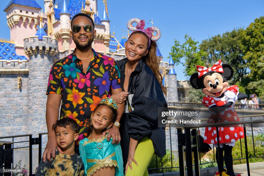 Chrissy Teigen And John Legend Visit Disneyland Resort in Anaheim, California