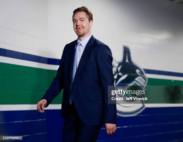Juho Lammikko of the Vancouver Canucks walks to the Canucks dressing room before their NHL game against the Arizona Coyotes at Rogers Arena April 14,...