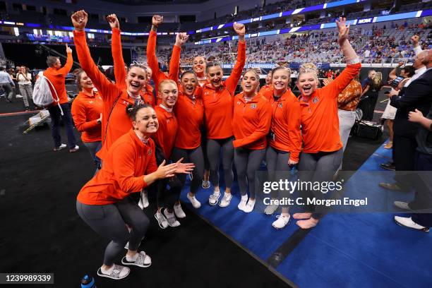 Sunisa Lee of the Auburn Tigers and the Auburn Tigers celebrate after advancing to the championship during the Division I Womens Gymnastics...