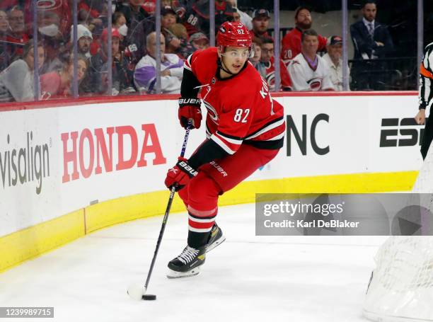 Jesperi Kotkaniemi of the Carolina Hurricanes controls the puck behind the net during an NHL game against the Detroit Red Wings on April 14, 2022 at...