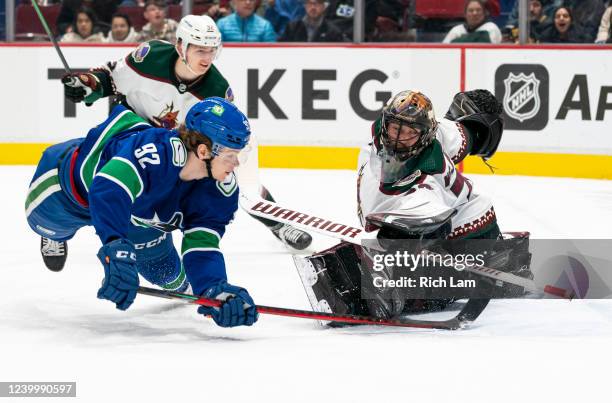 Vasily Podkolzin of the Vancouver Canucks shoots and scores past goalie Karel Vejmelka of the Phoenix Coyotes in the second period at Rogers Arena on...