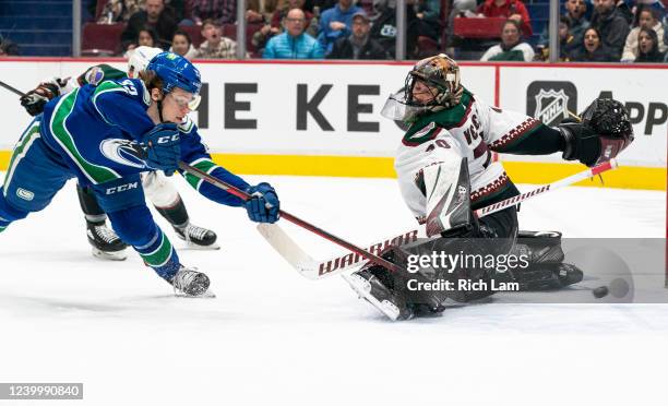 Vasily Podkolzin of the Vancouver Canucks shoots and scores on goalie Karel Vejmelka of the Phoenix Coyotes in the second period at Rogers Arena on...