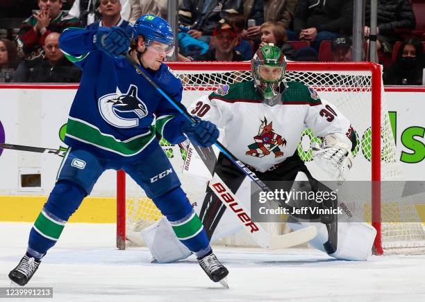 Sheldon Dries of the Vancouver Canucks tips a shot towards Harri Sateri of the Arizona Coyotes during their NHL game at Rogers Arena April 14, 2022...