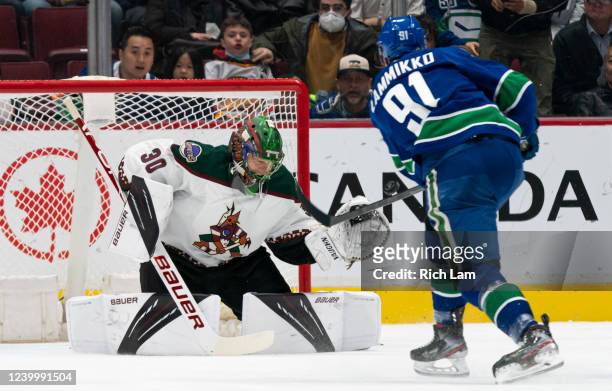 Juho Lammikko of the Vancouver Canucks fires a shot on goalie Harri Sateri of the Phoenix Coyotes during the third period in NHL action on April 14,...