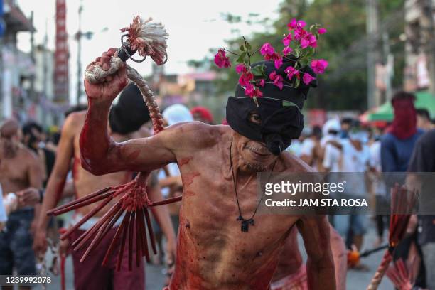 Catholic devotee flagellates himself to mark the holy week of Easter in Navotas, suburban Manila on April 15, 2022.