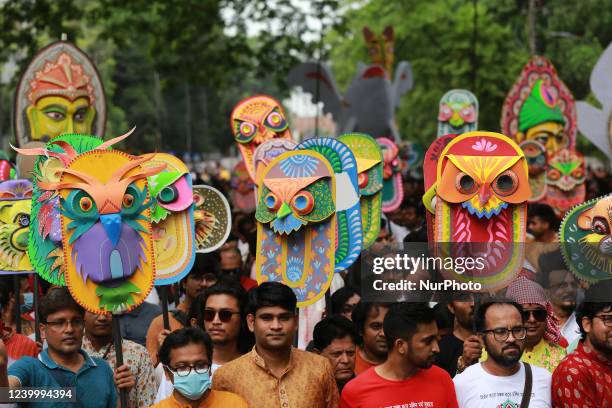 People participate in a rally to celebrate the Bengali New Year or Pohela Boishakh in Dhaka, Bangladesh on April 14, 2022.