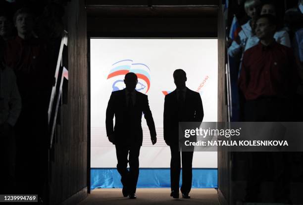 Russia's President Dmitry Medvedev and Prime Minister Vladimir Putin make a joint appearance at the congress of Russia's ruling party in Moscow, on...