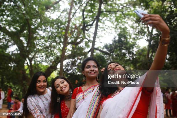 Girls take a selfie to celebrate the Bengali New Year or Pohela Boishakh in Dhaka, Bangladesh on April 14, 2022.
