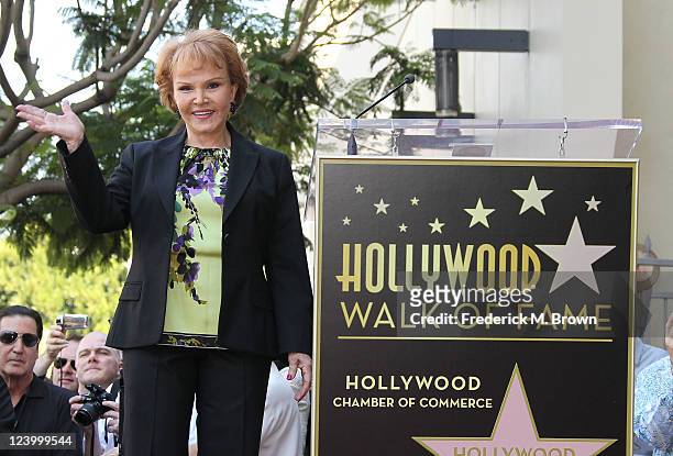 Maria Elena Holly poses for photographers during the ceremony for recording artist Buddy Holly's posthumous star on the Hollywood Walk of Fame on...
