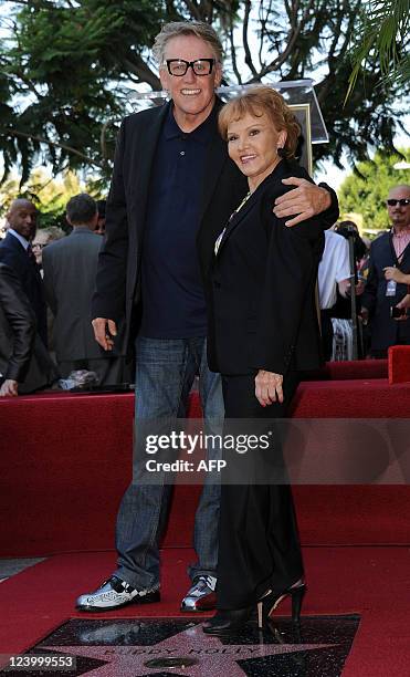 Maria Elena Holly and Gary Busey attend the Buddy Holly Hollywood Walk Of Fame Induction Ceremony in Hollywood, California September 7, 2011. AFP...