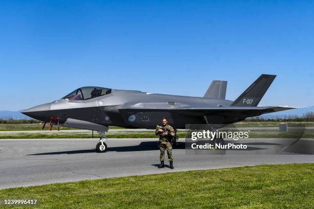 Dutch soldier guards Lockheed Martin F-35 Lightning II jet at Graf Ignatievo Air Force Base near Plovdiv, Bulgaria on 14 April, 2022. Four Lockheed...