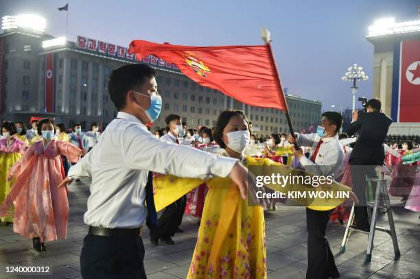 Students and youth attend a dancing party in celebration of the 110th birth anniversary of President Kim Il Sung, known as 'Day of the Sun', at Kim...