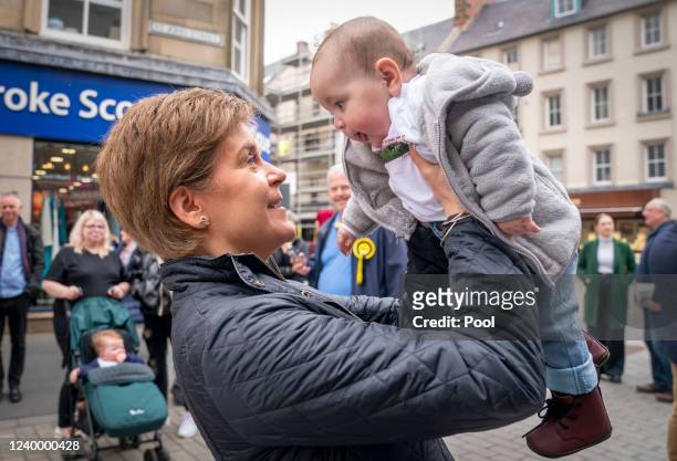 First Minister Nicola Sturgeon meets 6-month-old Winnie Moore in Perth city centre, during local election campaigning on April 15, 2022 in Perth,...