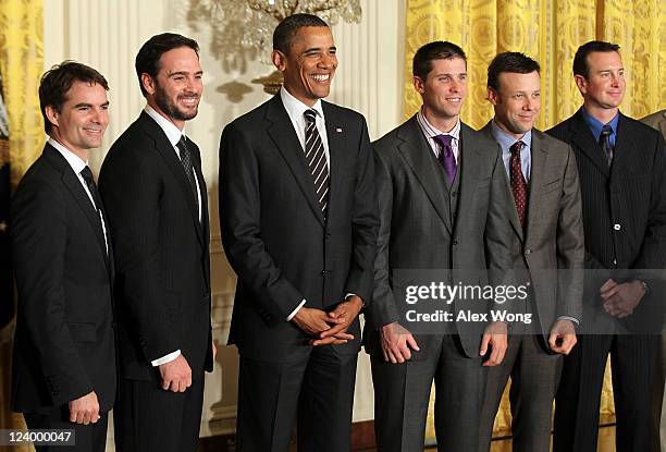 President Barack Obama poses for a group picture with NASCAR drivers Jeff Gordon, Jimmie Johnson, Denny Hamlin, Matt Kenseth, and Kurt Busch during...