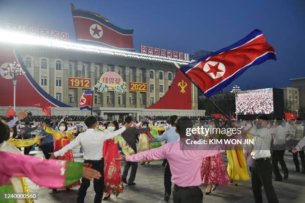 Students and youth attend a dancing party in celebration of the 110th birth anniversary of President Kim Il Sung, known as 'Day of the Sun', at Kim...