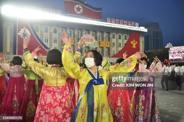 Students and youth attend a dancing party in celebration of the 110th birth anniversary of President Kim Il Sung, known as 'Day of the Sun', at Kim...