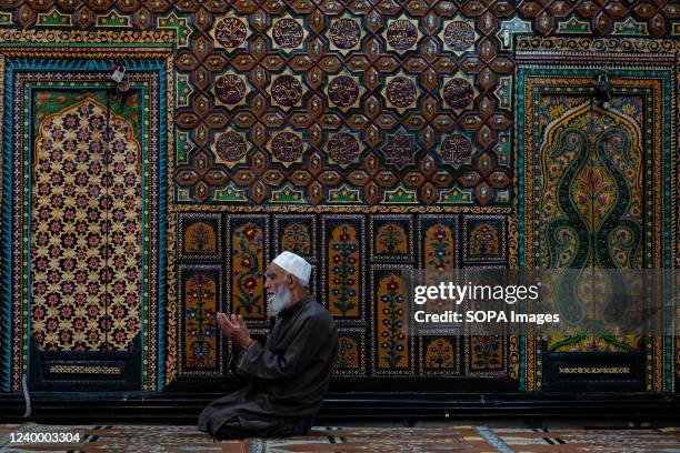 Muslim man offers Friday prayers inside a Shrine during Ramadan. Islam's holiest month Ramadan is a period of intense prayer, dawn-to-dusk fasting...