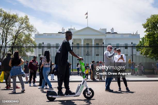 Tourists gather in front of the White House April 15, 2022 in Washington, DC. Public tours of the White House are beginning to resume after being...