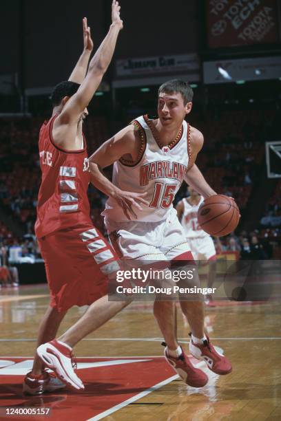 Dan Miller, Guard for the University of Maryland Terrapins dribbles the ball past Josh Little, Guard for the University of Stony Brook Seawolves...