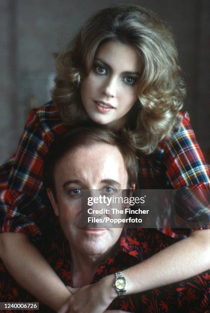 British actor Peter Sellers posing with his wife Lynne Frederick during a break in filming "The Prisoner of Zenda", circa 1979.