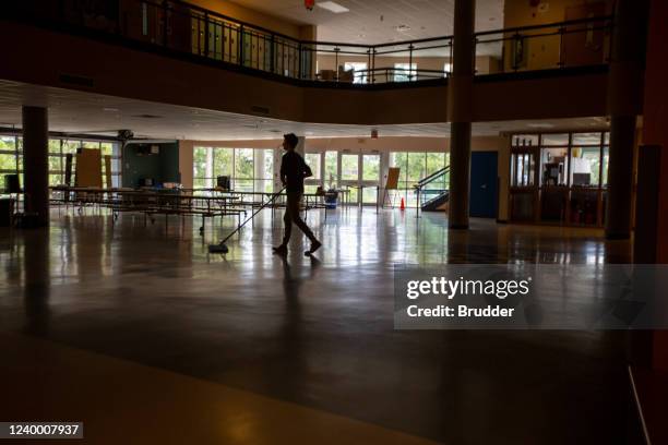 janitor cleans empty school entrance and foyer - school caretaker stock pictures, royalty-free photos & images