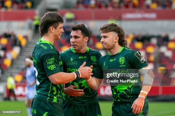 Kyle Rowe of London Irish celebrates with his teammates Nick Phipps and Benhard van Rensburg after scoring a try during the European Rugby Challenge...