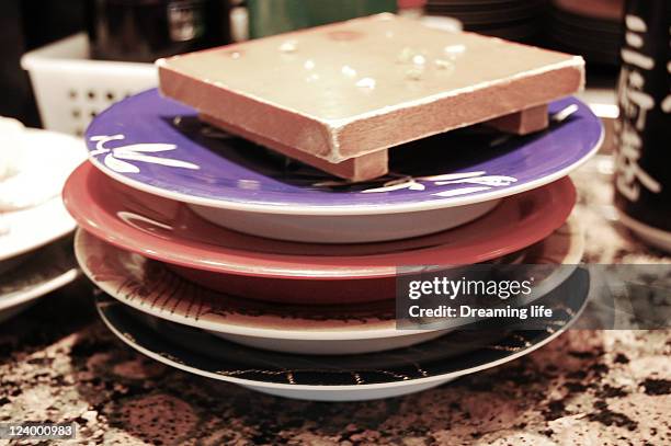 sushi kaiten dishes - sushi plate stock pictures, royalty-free photos & images