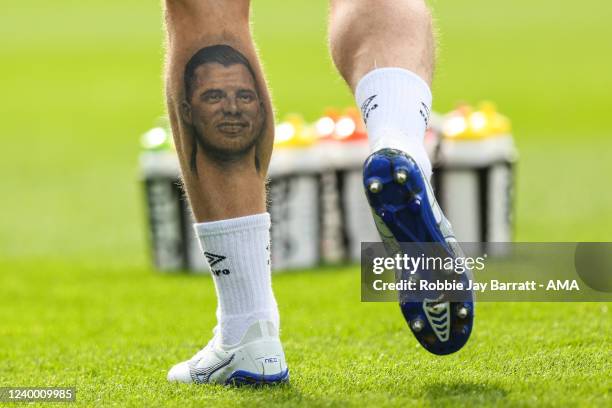 Tattoo of Jordan Sinnott is seen on the calf of Danny Ward of Huddersfield Town during the Sky Bet Championship match between Huddersfield Town and...