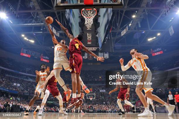 De'Andre Hunter of the Atlanta Hawks drives to the basket against the Cleveland Cavaliers during the 2022 Play-In Tournament on April 15, 2022 at...