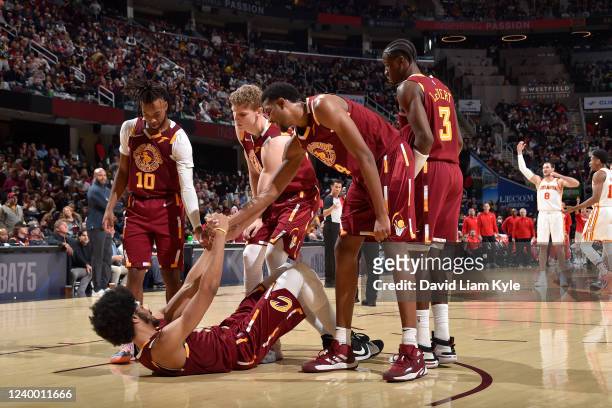 The Cleveland Cavaliers help up Jarrett Allen during the 2022 Play-In Tournament on April 15, 2022 at Rocket Mortgage FieldHouse in Cleveland, Ohio....