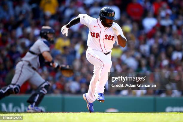 Jackie Bradley Jr. #19 of the Boston Red Sox bunts for a hit in the fifth inning during the game between the Minnesota Twins and the Boston Red Sox...
