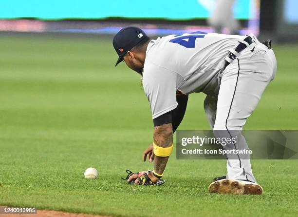 Detroit Tigers shortstop Harold Castro can't make a play on a ball hit off a single by Kansas City Royals left fielder Andrew Benintendi during a...