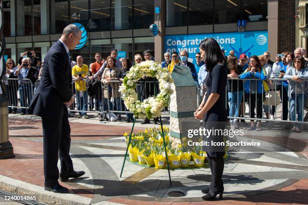 Massachusetts Governor Charlie Baker and Boston Mayor Michelle Wu observe a moment of silence at the site of the Boston Marathon bombing memorial at...