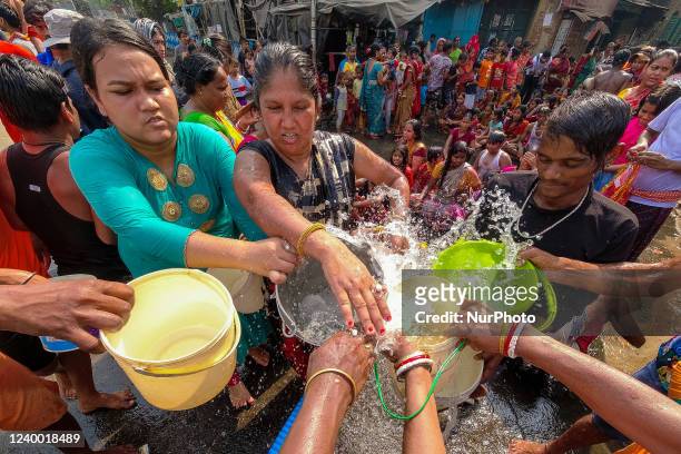 People are seen filling water from a municipal tanker on a hot day in Kolkata , India , on 16 April 2022 . Meteorological department of India has...