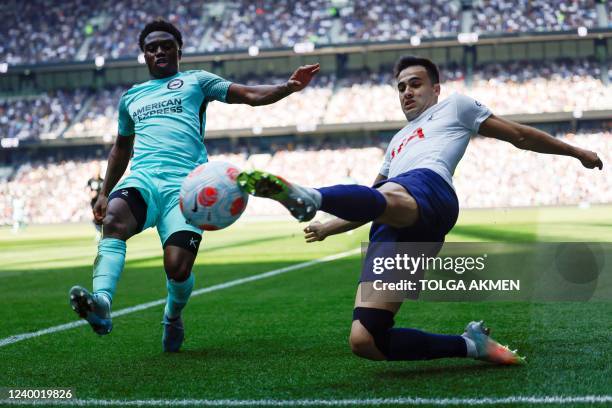Brighton's English midfielder Tariq Lamptey fights for the ball with Tottenham Hotspur's Spanish defender Sergio Reguilon during the English Premier...