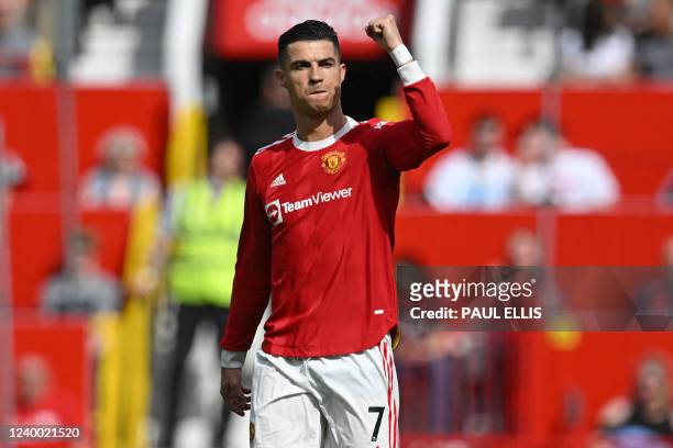 Manchester United's Portuguese striker Cristiano Ronaldo celebrates after scoring the opening goal of the English Premier League football match...