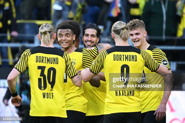 Dortmund's players celebrate Dortmund's Swiss defender Manuel Akanji for scoring the 3-0 goal during the German first division Bundesliga football...