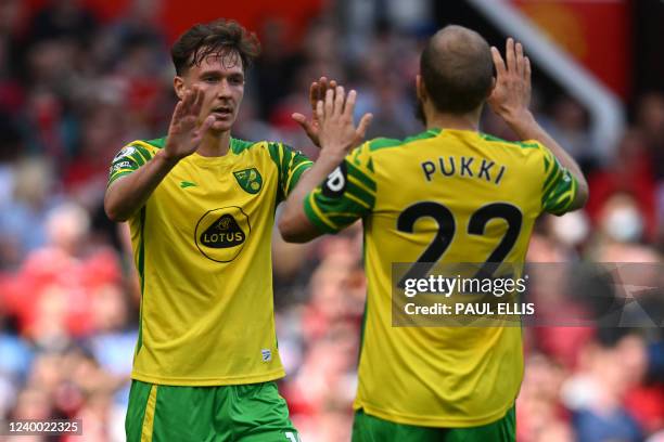 Norwich City's English midfielder Kieran Dowell celebrates with Norwich City's Finnish striker Teemu Pukki after scoring their first goal during the...