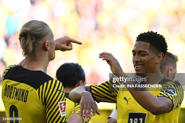 Dortmund's Norwegian forward Erling Braut Haaland celebrates scoring the 6-0 goal with Dortmund's English midfielder Jude Bellingham during the...