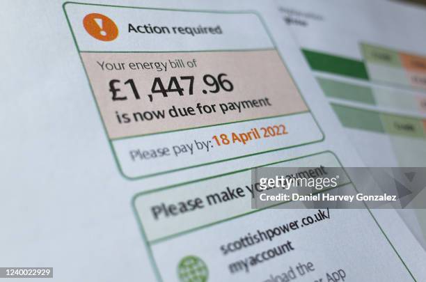 In this photo illustration, a bill from energy provider Scottish Power for an amount totalling £1,447.96 is marked as being due payment, with "action...