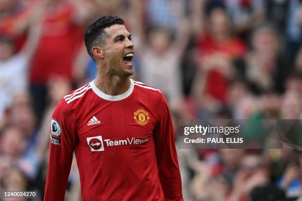 Manchester United's Portuguese striker Cristiano Ronaldo celebrates after scoring his third goal during the English Premier League football match...