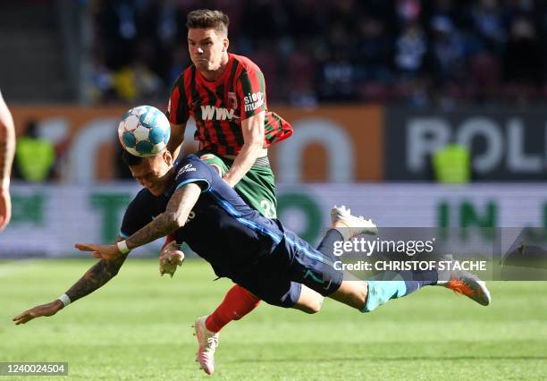 Hertha Berlin's striker Davie Selke and Augsburg's defender Raphael Framberger vie for the ball during the German first division Bundesliga match...