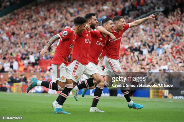 Cristiano Ronaldo of Manchester United celebrates with Jadon Sancho of Manchester United , Bruno Fernandes of Manchester United and Diogo Dalot of...