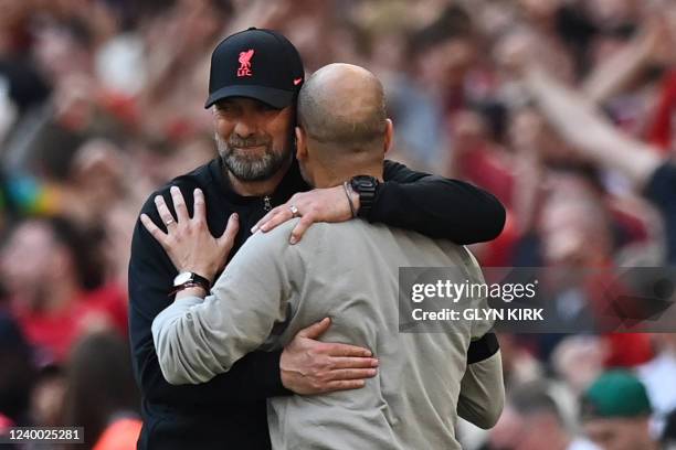Liverpool's German manager Jurgen Klopp and Manchester City's Spanish manager Pep Guardiola congratulate each other at the end of the English FA Cup...